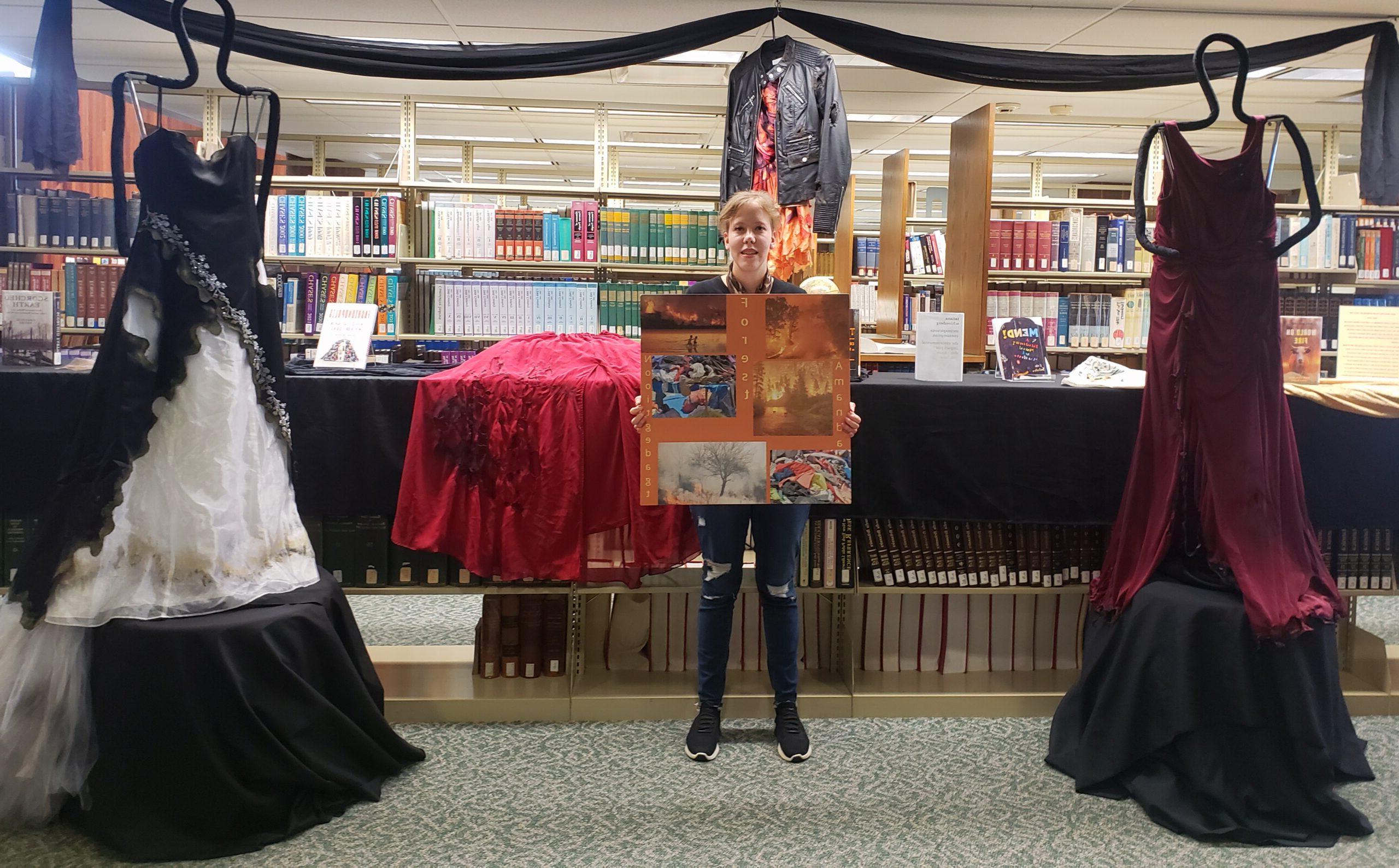 dresses and books on display at the library