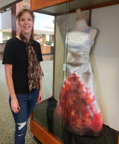 dresses and books on display at the library